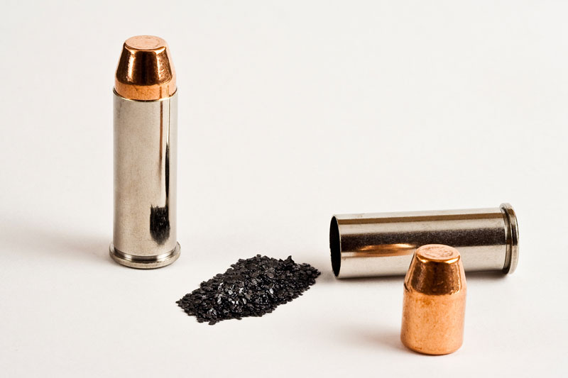 2 bullets with shell casing and gunpowder