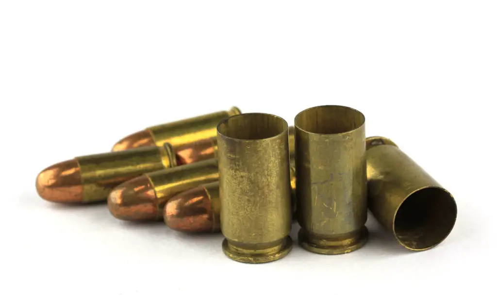 Pistol handgun empty bullet cartridges ready for reloading with gunpowder