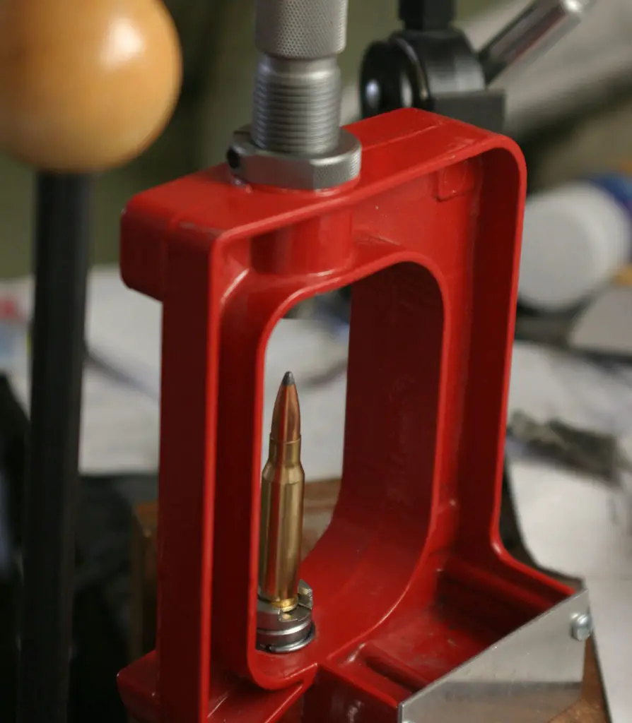 Single Stage Bullet Press with a rifle bullet being reloaded