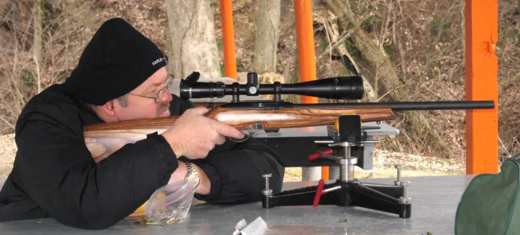 Remington 597 being fired from a mount on a table