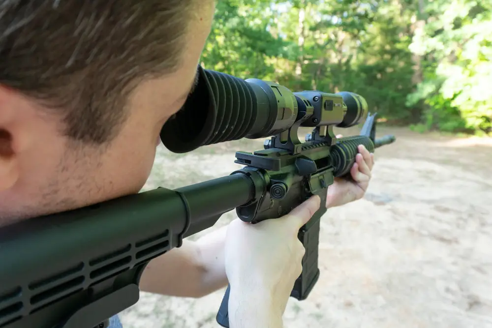 Shooting a rifle with the ATN Thor LT thermal scope mounted on it