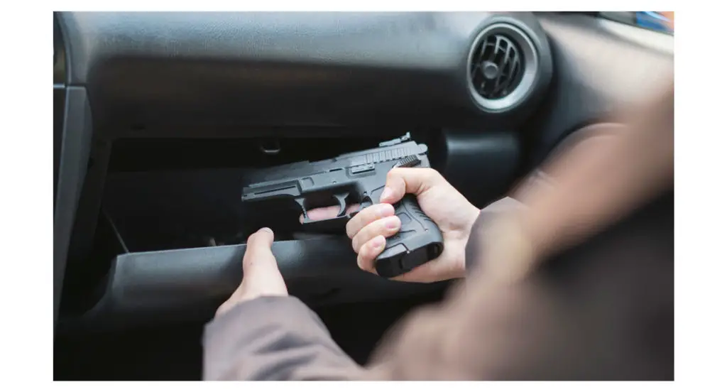 Man carrying a pistol in his car glove box
