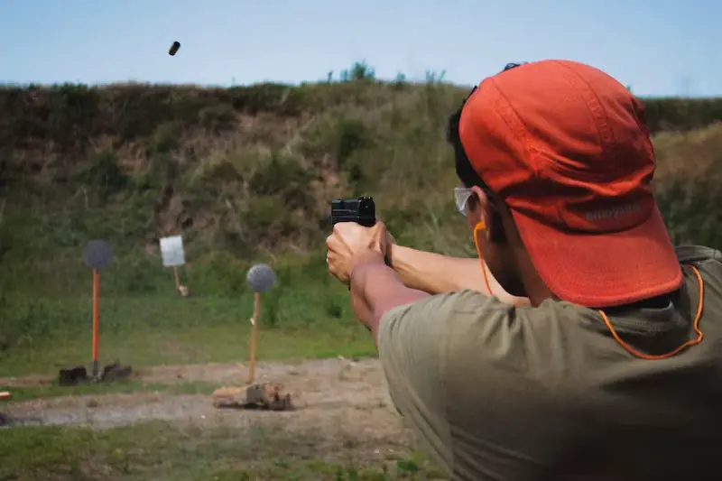 Man shooting at a target range for practice