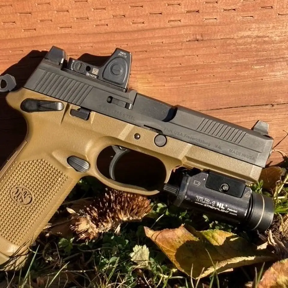 trijicon red dot mounted on FN pistol