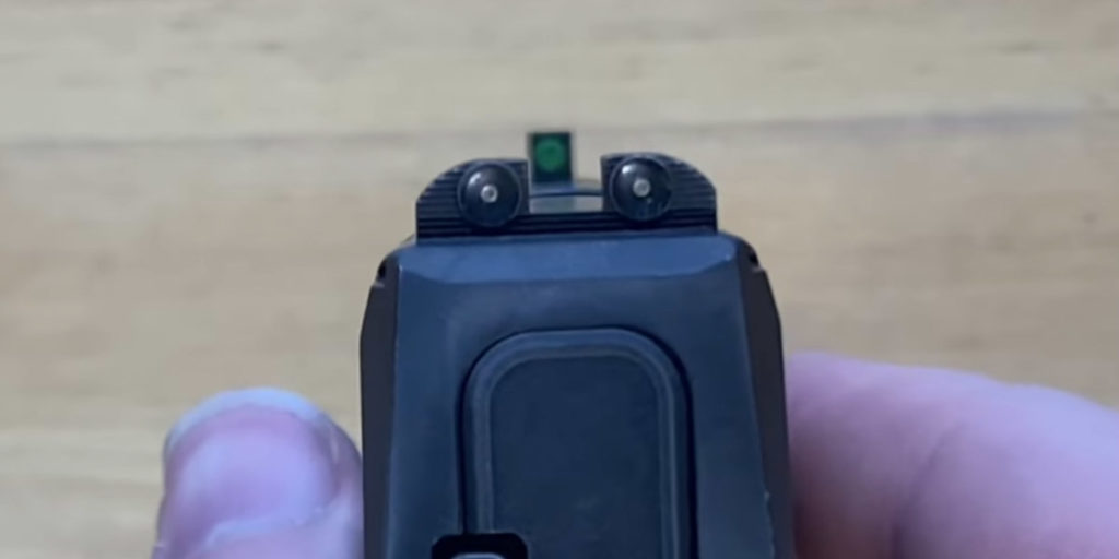 Tritium iron sights front and rear of Sig P365 pistol