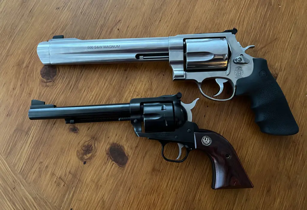 Smith & Wesson 500 next to a Ruger Blackhawk in .357 Magnum for size comparison 