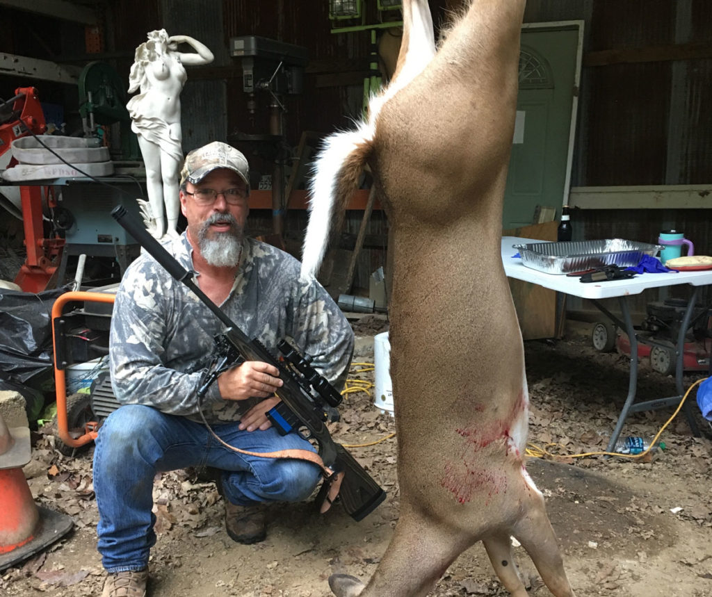 Author with deer he hunted using the  Vortex Crossfire II 1-4X24 scope and rifle