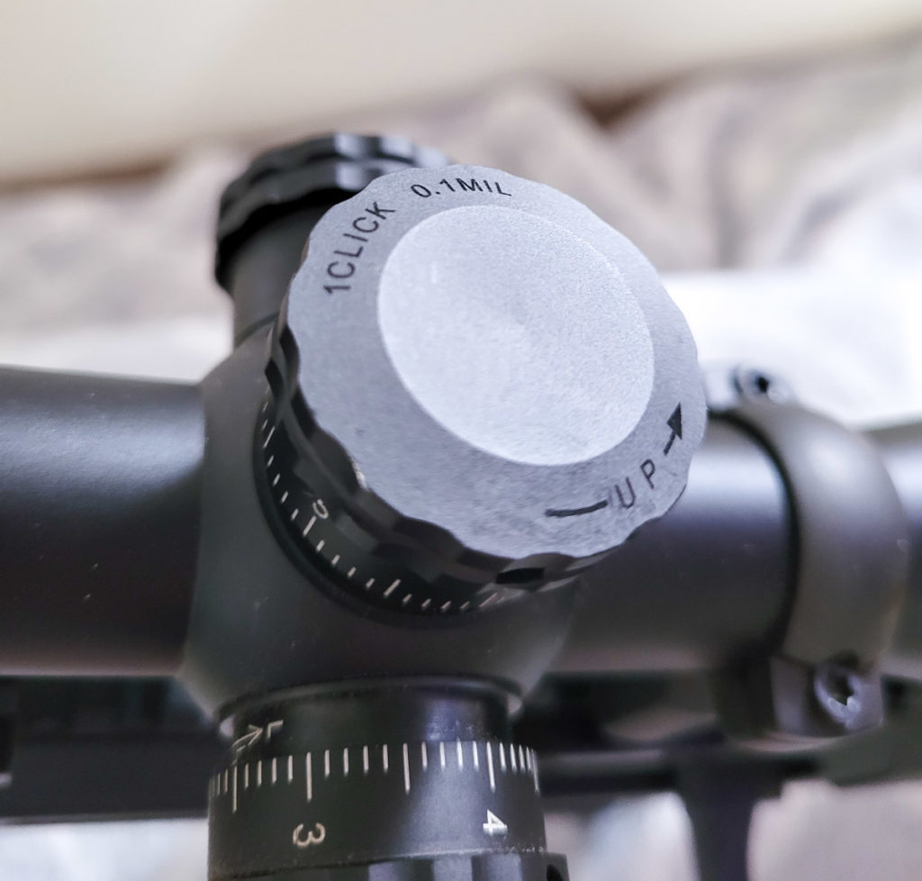 Top adjustment turret of the Bushnell AR Scope with 1 click = 0.1 MIL