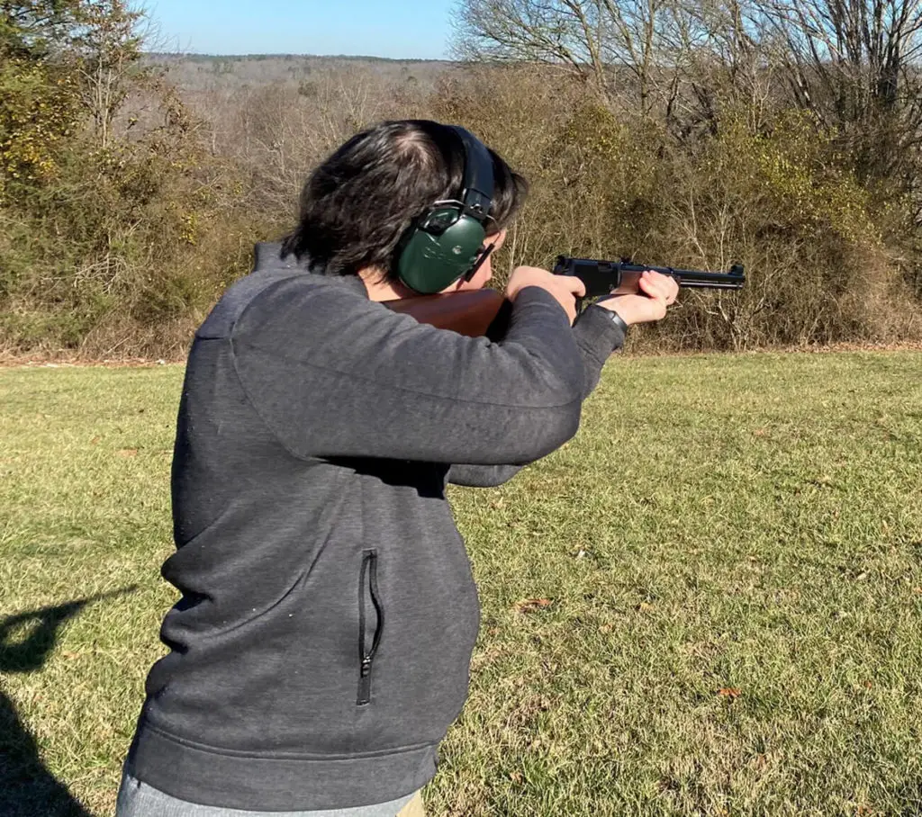 Man shooting a Henry Lever action 22 long rifle