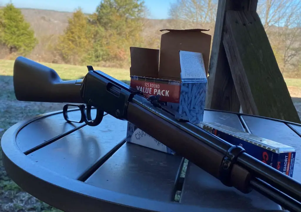 Henry Lever Action 22 on table with ammo