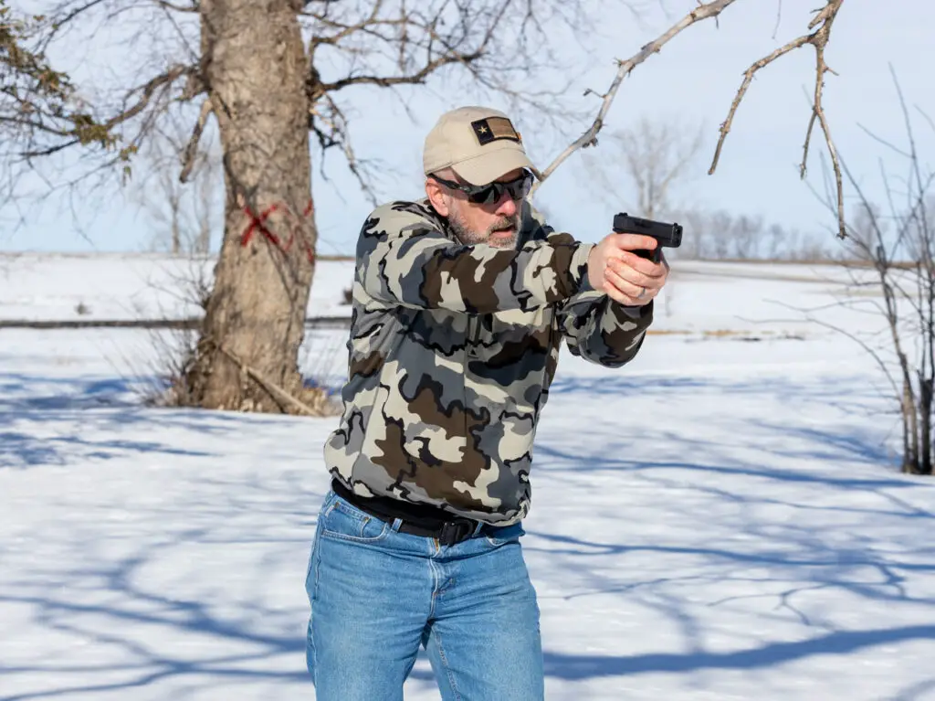 Man firing a Glock 43 pistol