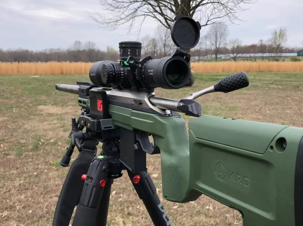 Arken Optics SH4 GenII scope mounted on a rifle using a tripod stand for testing and accuracy