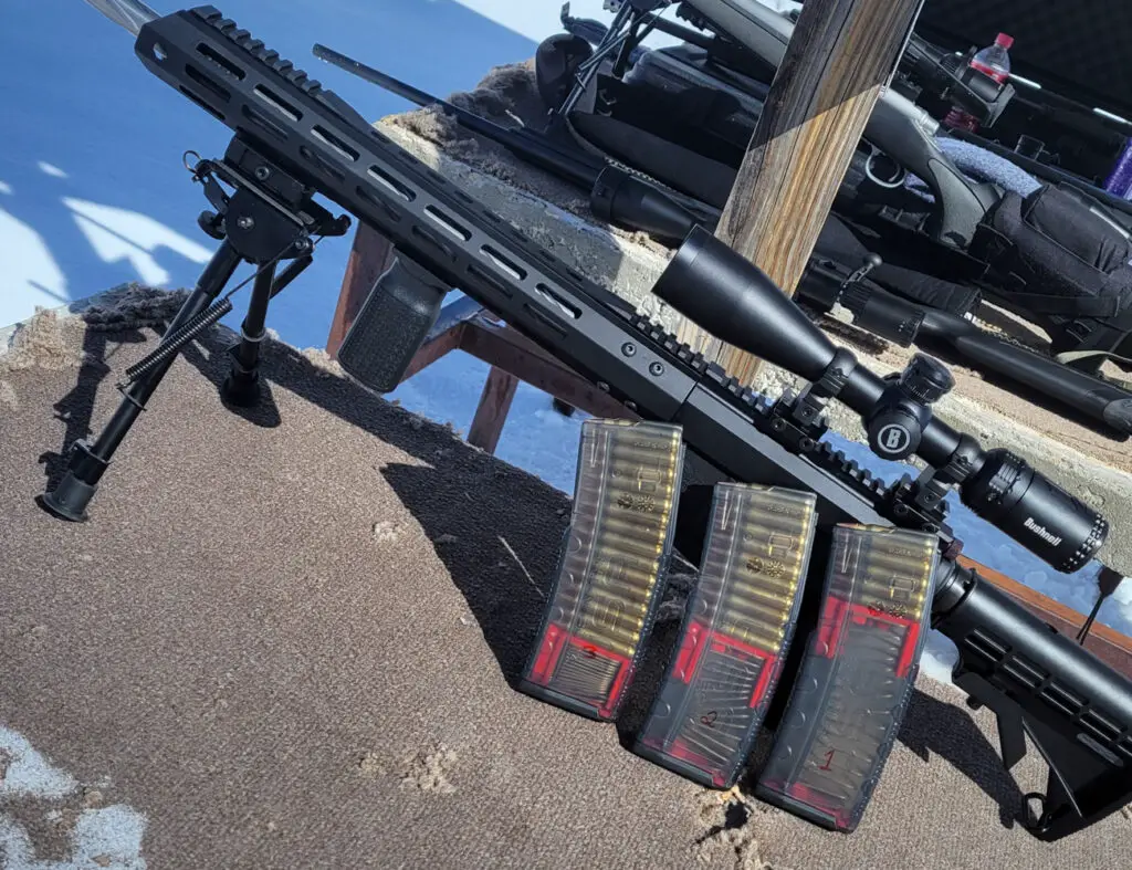 Amend2 Mags beside an AR15 rifle