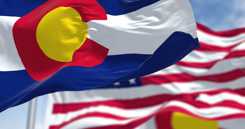 Colorado state flag next to American flag