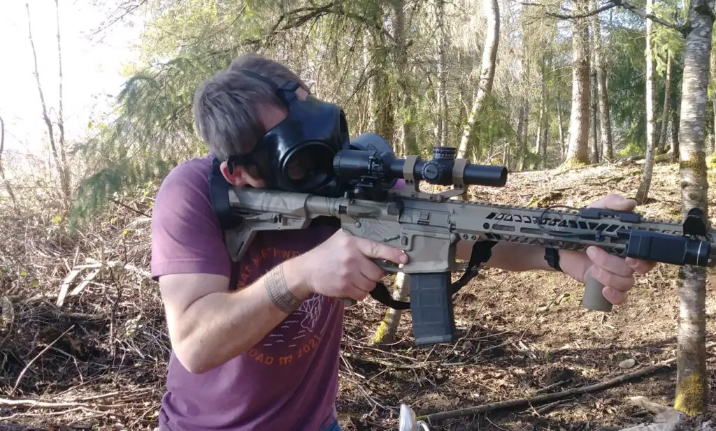 Shooting an AR15 rifle with the MIRA Safety gas mask for testing