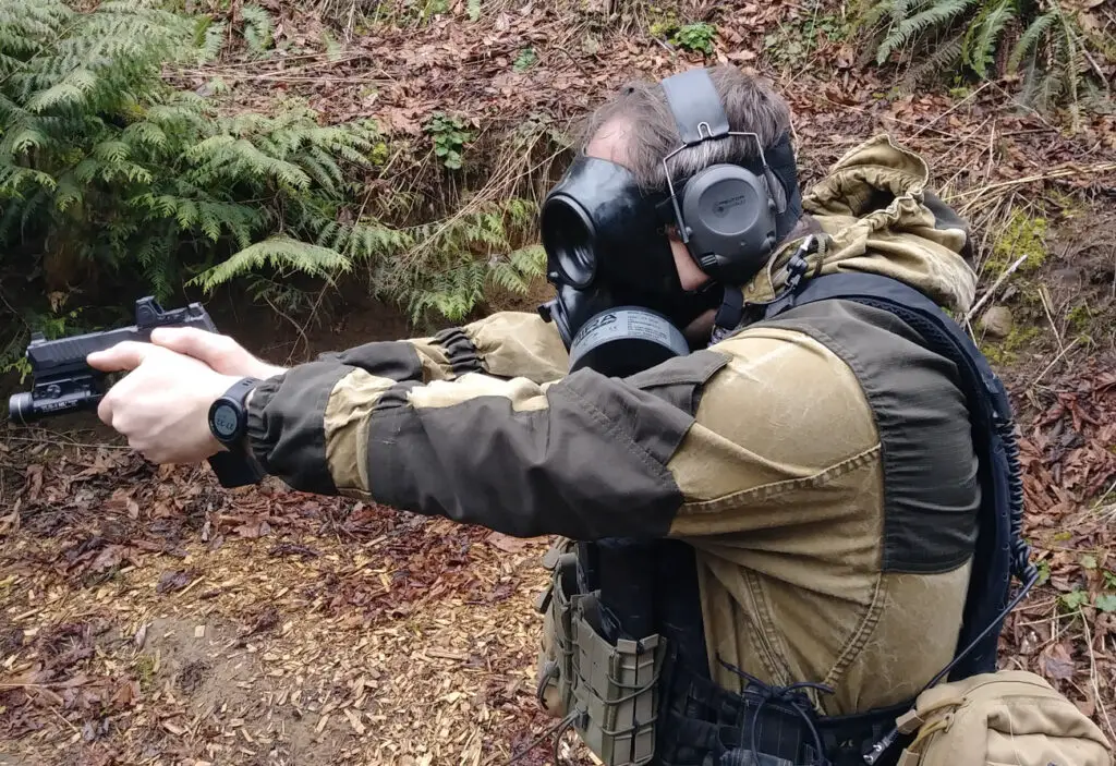Shooting a pistol while wearing a MIRA Safety gas mask
