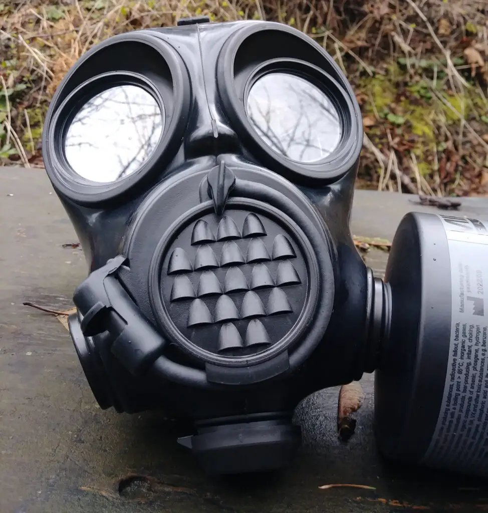 MIRA Safety Gas mask with filter attached to the side of it