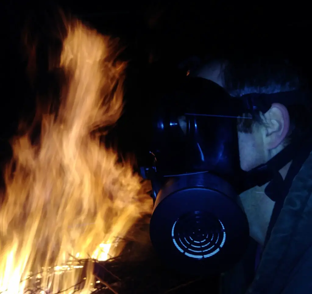 MIRA Safety gas mask testing it next to open flames and smoke from a fire