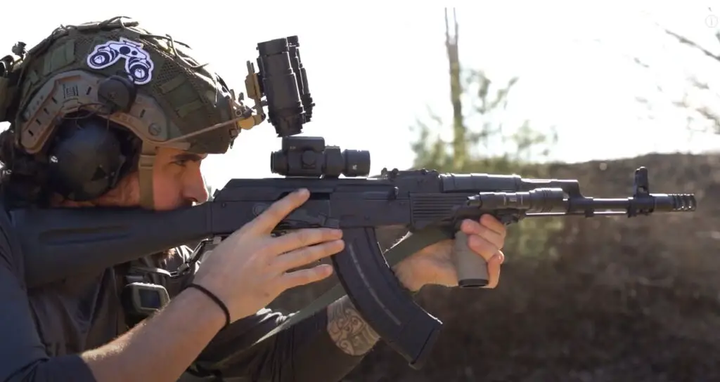 Man shooting rifle with a Vortex Strikefire 2 red dot reflex sight