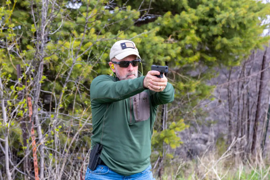 Man shooting the Glock 19 handgun