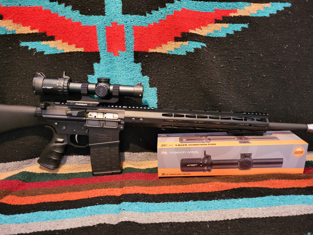 Primary Arms SLX 1-6x24 scope on a rifle with box