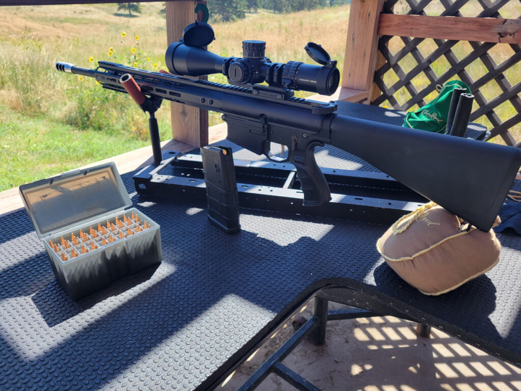 Primary Arms SLx 3-18x50 mounted on a rifle at the gun range