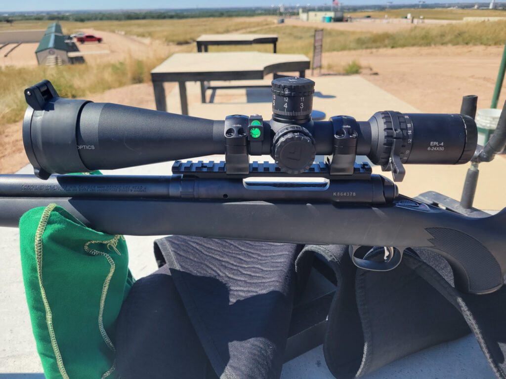 Arken EPL-4 at the gun range mounted on a hunting rifle
