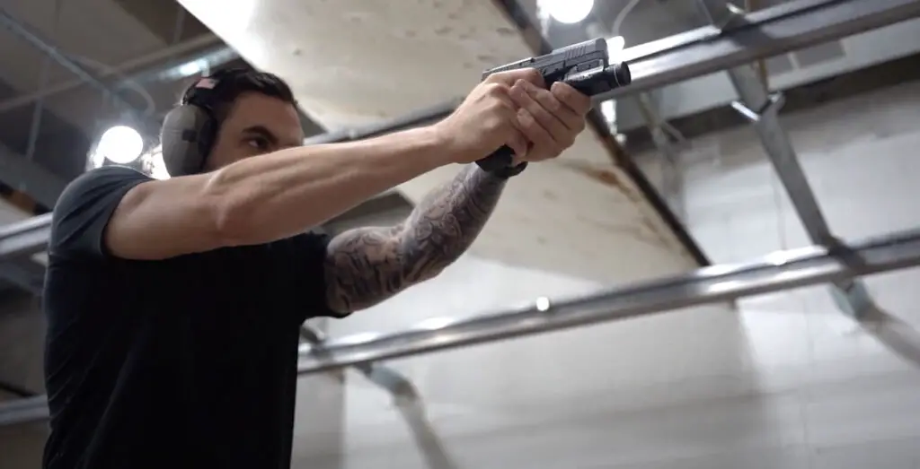 Man Firing the PSA Dagger at the gun range