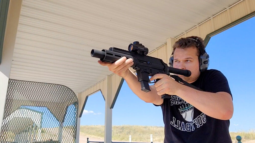 Man shooting a Extar EP9 ar pistol at the gun range