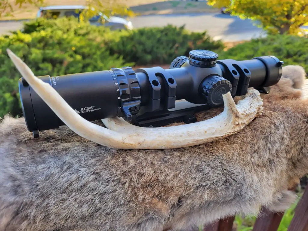 Primary Arms SLX 1-10x28 scope with antlers or horns on animal fur