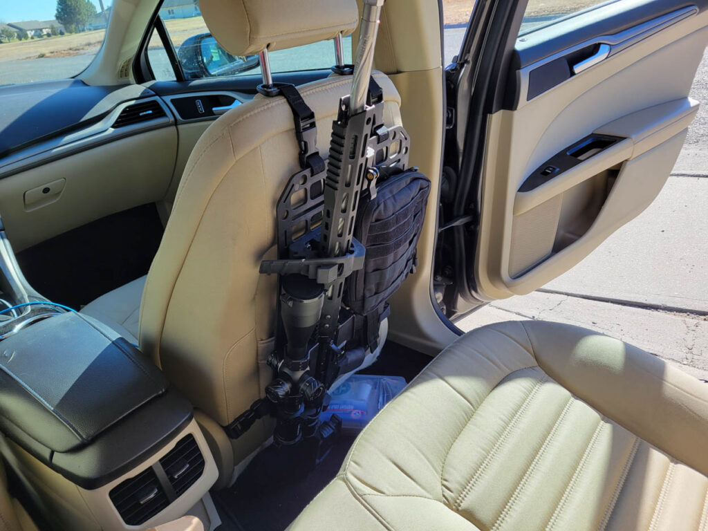 Grey Man Tactical Vehicle Seat Rifle Rack with AR 15 rifle mounted in it